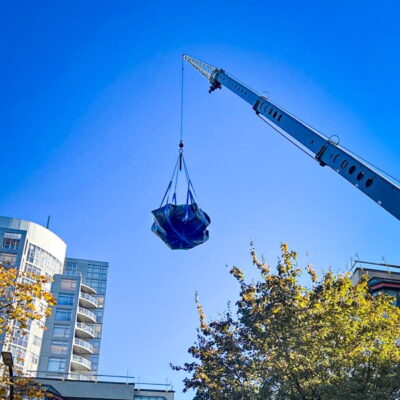 Lifting a load of trash with StrongSling and a crane.