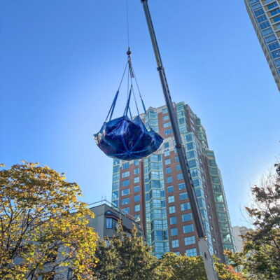 Lifting a load of trash with StrongSling and a crane.