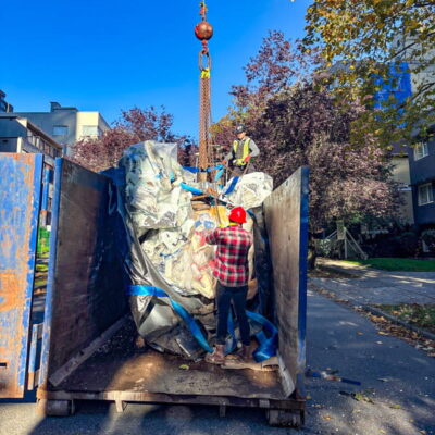 Dumping trash into a container with a StrongSling.