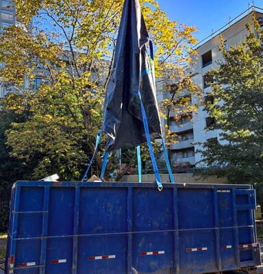 Empty StrongSling after dumping trash into a container.